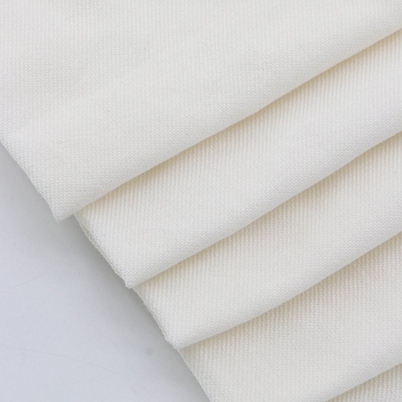 Meta-aramid base cloth for retroreflective safety tape, natural undyed twill weave