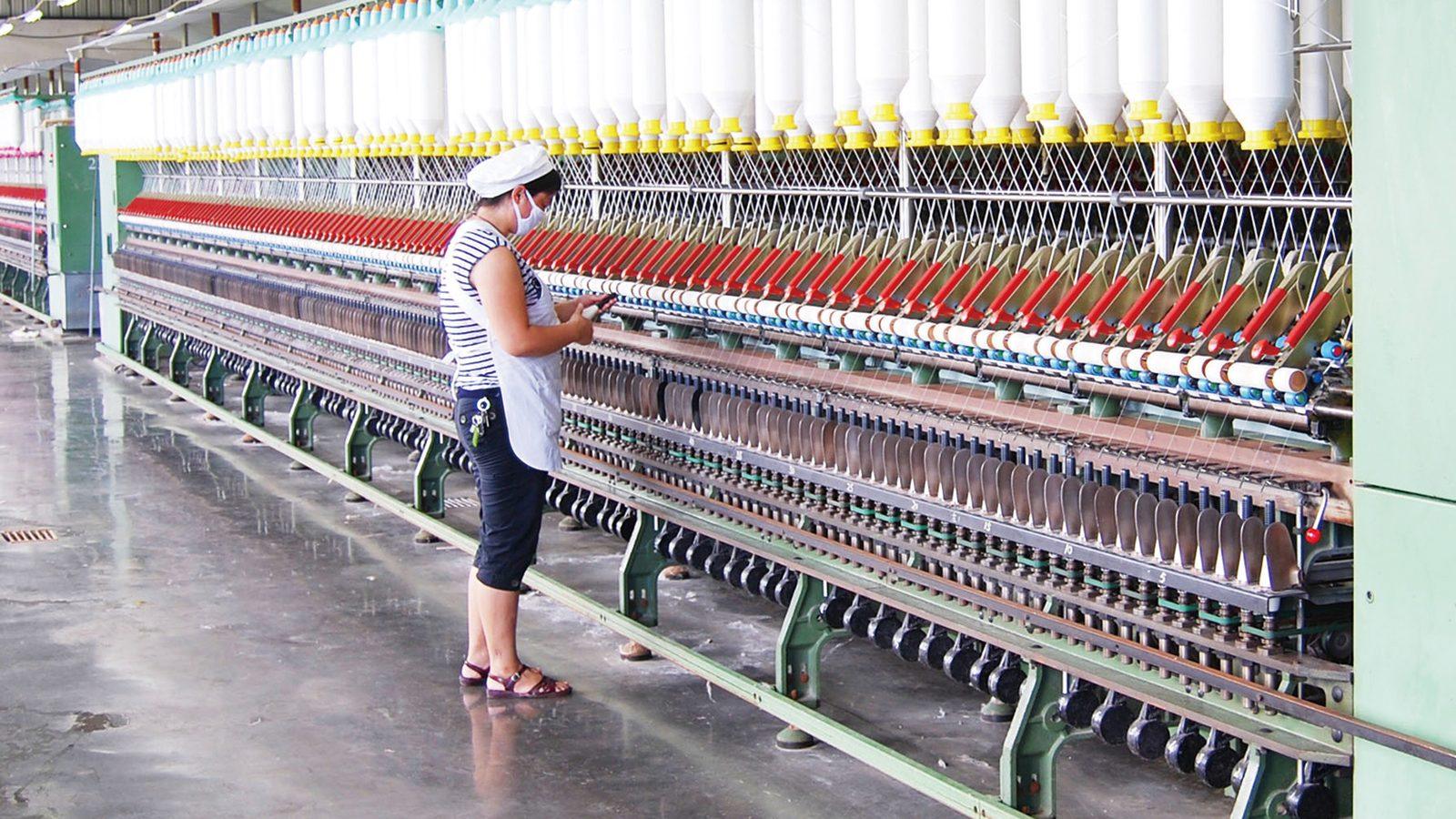 Meta-aramid yarn being spun on ring frames in the mill