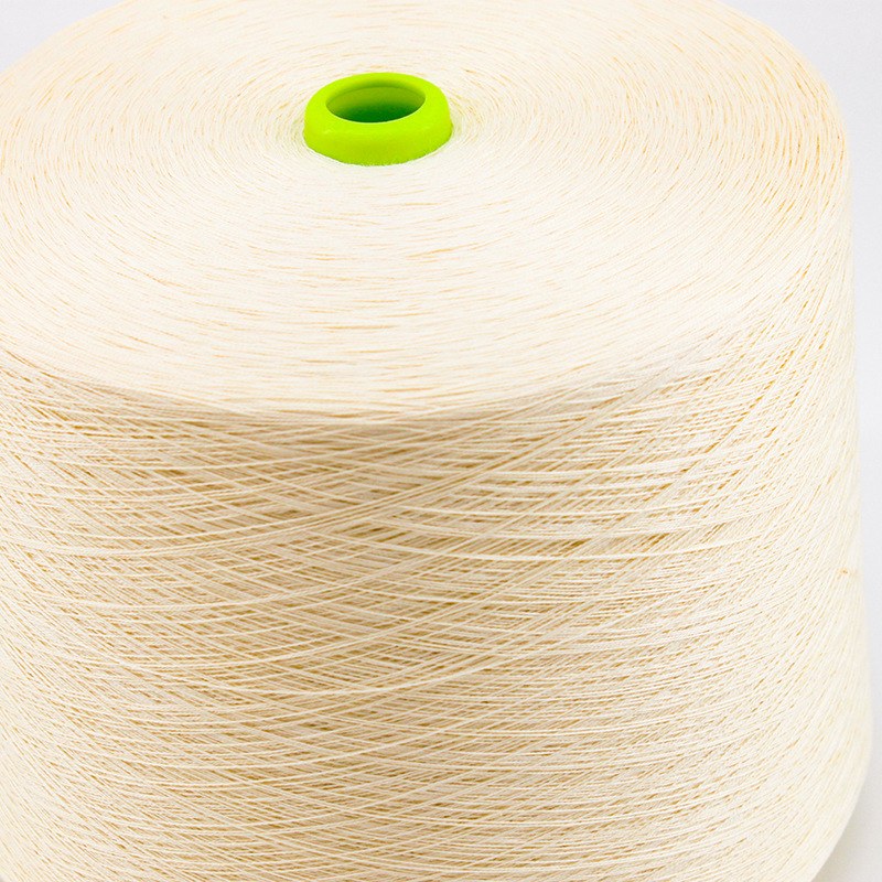 Raw-white meta-aramid yarn on a cone